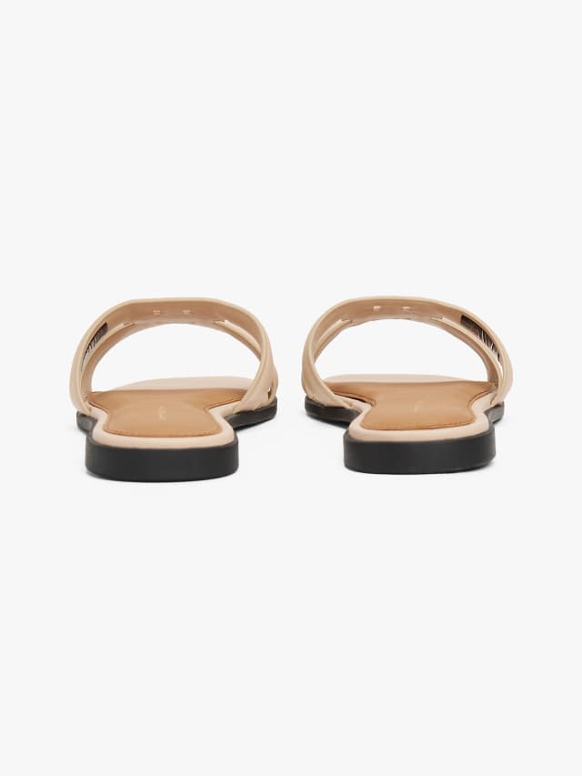 Mules en cuir à monogramme TH